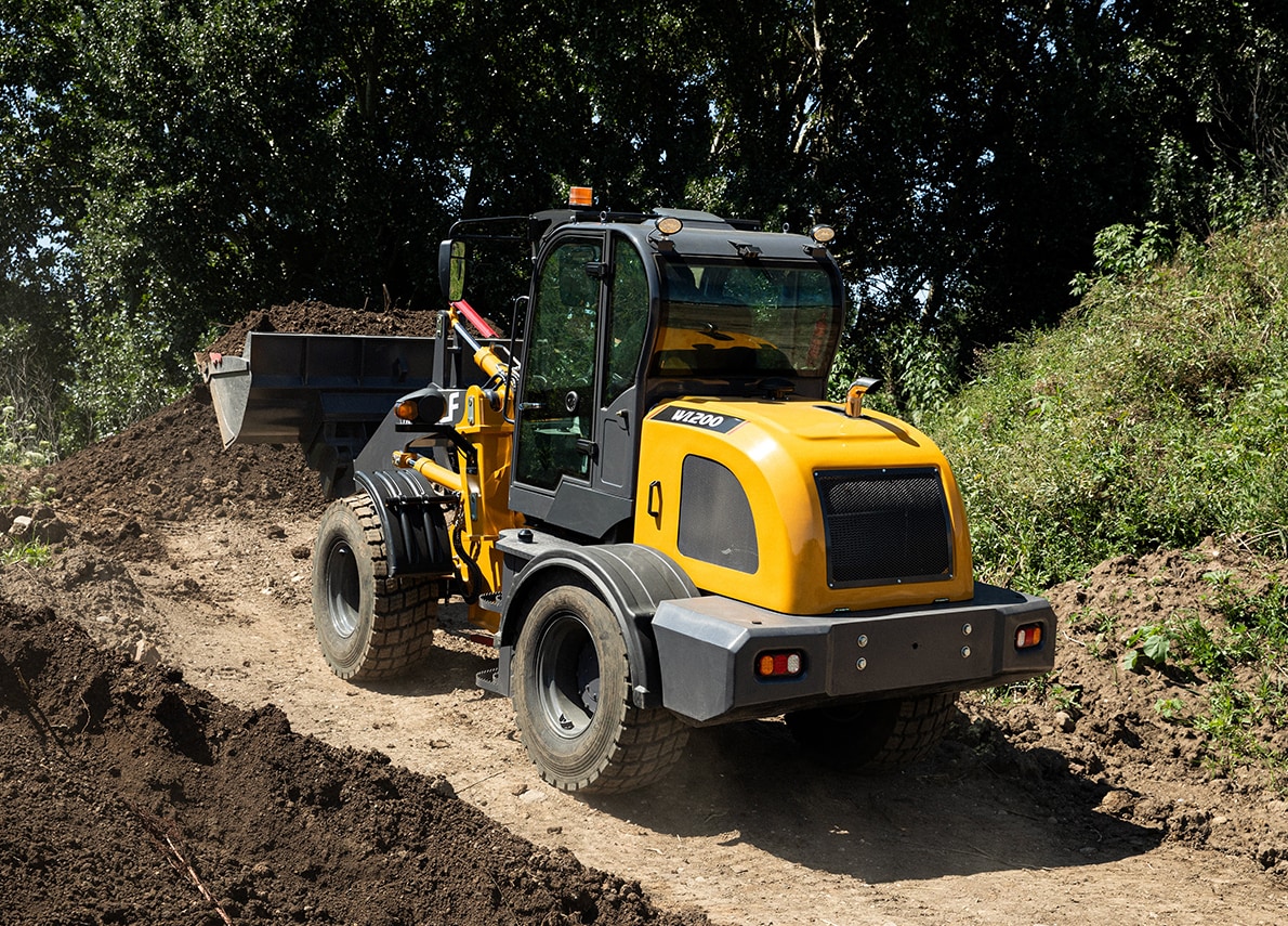 WL200 pushing dirt up a hill